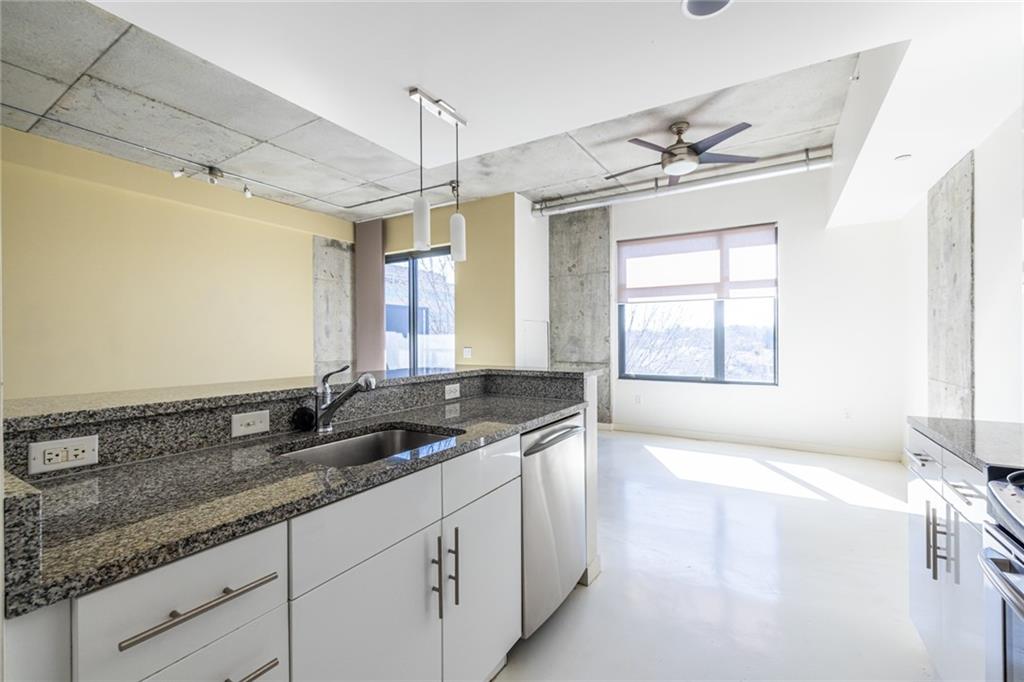 335 West Ponce De Leon Avenue, Unit 506 Decatur, GA 30030 - Photo 20 of 49 a bathroom with sinks granite granite countertop a sink and a window