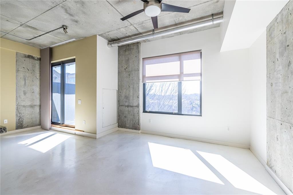 335 West Ponce De Leon Avenue, Unit 506 Decatur, GA 30030 - Photo 24 of 49 an empty room with windows