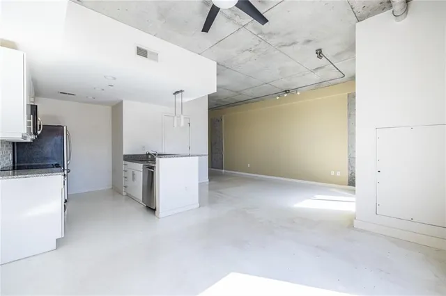 a view of a kitchen with a sink