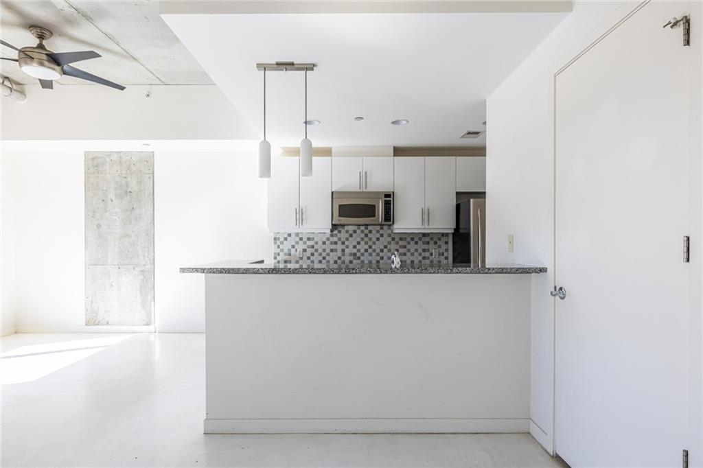 335 West Ponce De Leon Avenue, Unit 506 Decatur, GA 30030 - Photo 27 of 49 a view of a living room with a fireplace