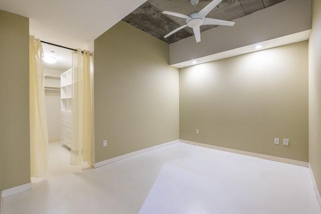 335 West Ponce De Leon Avenue, Unit 506 Decatur, GA 30030 - Photo 28 of 49 an empty room with windows and fan