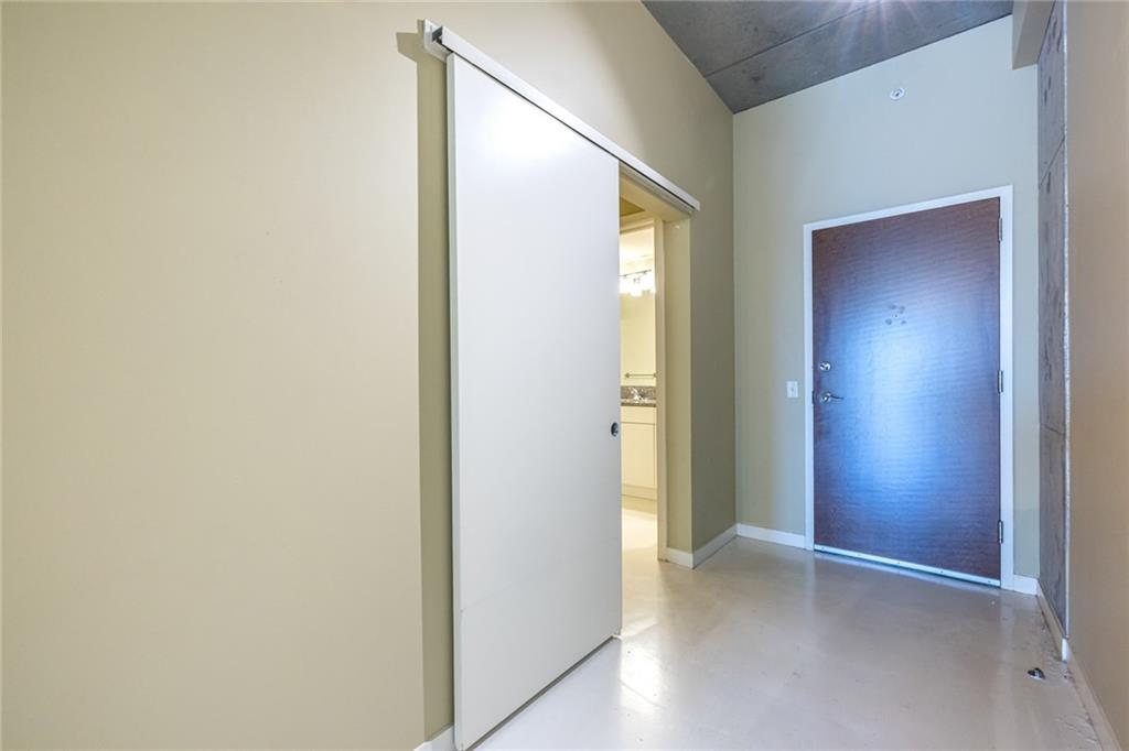 335 West Ponce De Leon Avenue, Unit 506 Decatur, GA 30030 - Photo 40 of 49 an empty room with windows and closet