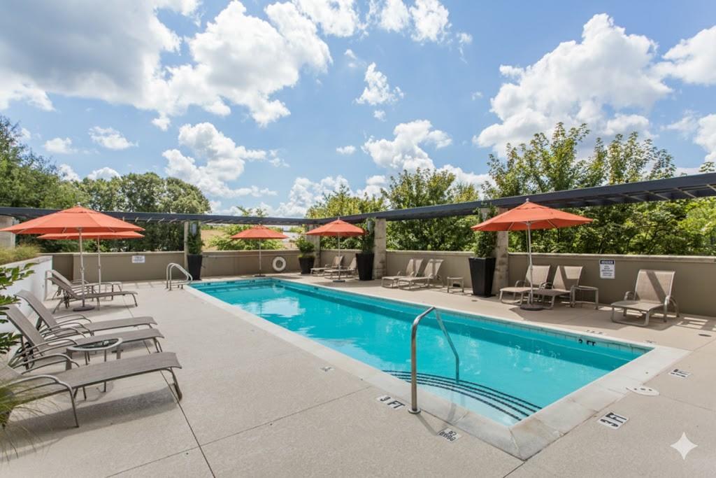 335 West Ponce De Leon Avenue, Unit 506 Decatur, GA 30030 - Photo 47 of 49 a view of a patio with swimming pool table and chairs