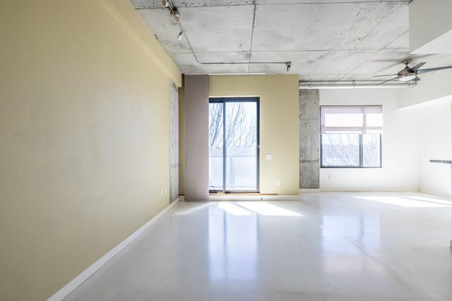 335 West Ponce De Leon Avenue, Unit 506 Decatur, GA 30030 - Photo 9 of 49 a view of an empty room with a window