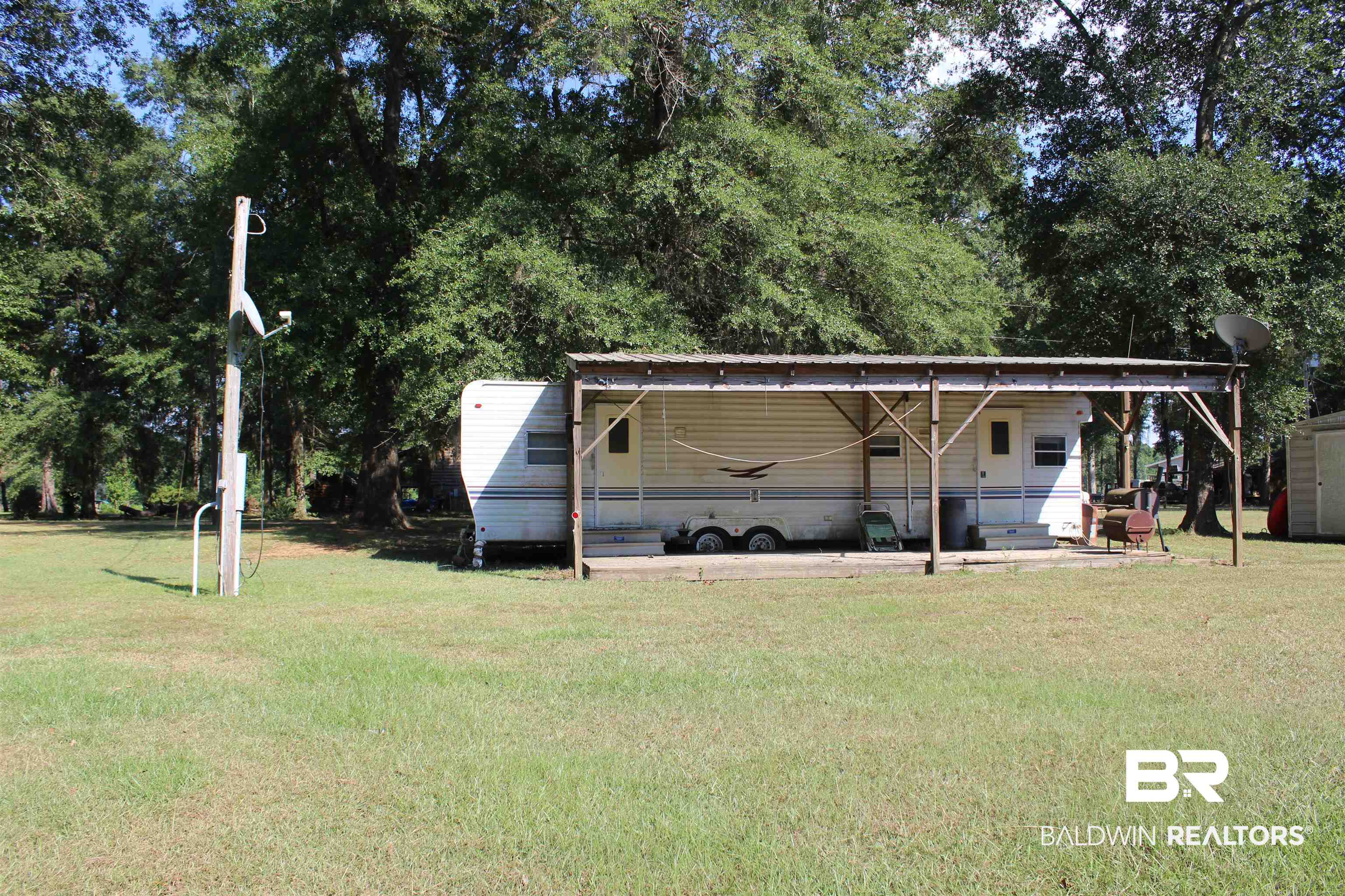 7258 Henderson Road Lowndesboro, AL 36752 - Photo 21 of 22 View of grassy yard featuring an outdoor structure