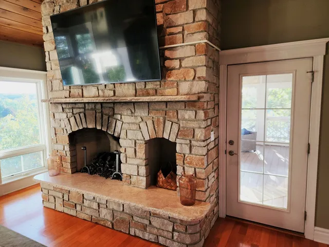 a living room with furniture and a fireplace