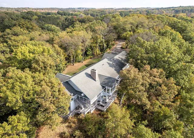 an aerial view of houses with yard