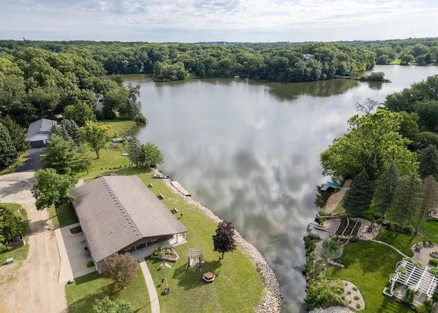 an aerial view of a house with a lake view
