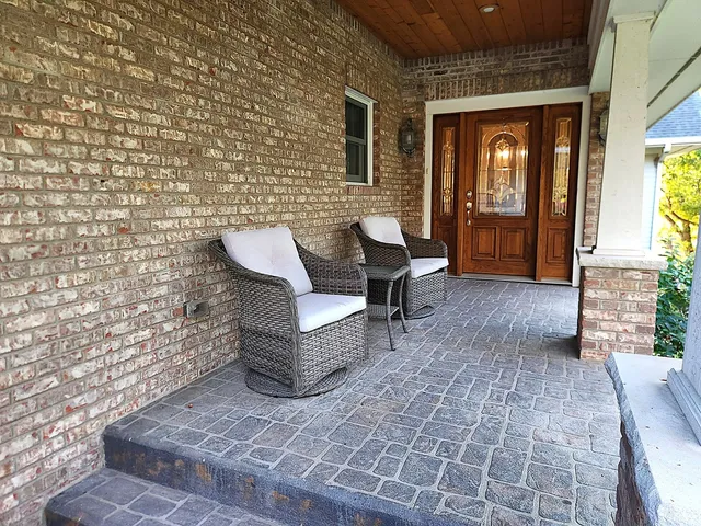 a view of a entryway door and outdoor seating