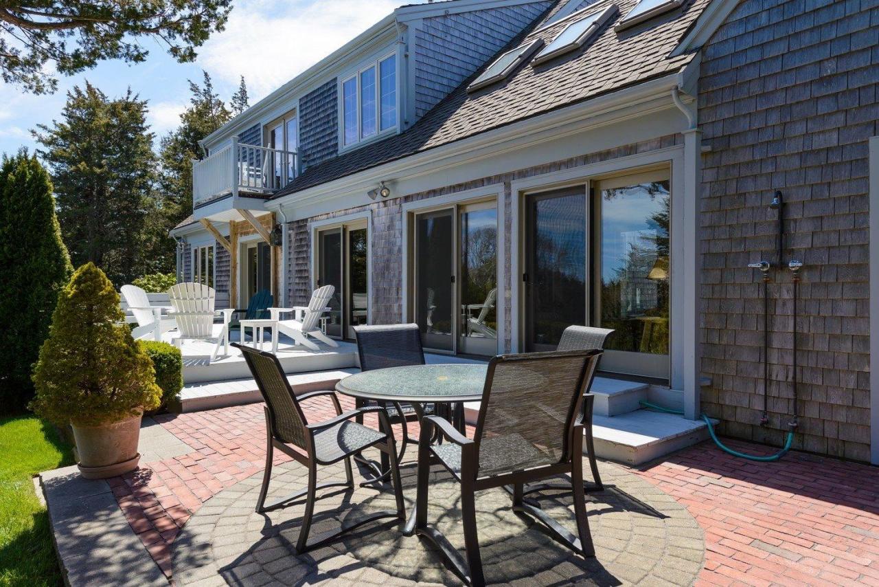52 Point Hill Road West Barnstable, MA 02668 - Photo 6 of 28 a view of a patio with table and chairs and potted plants