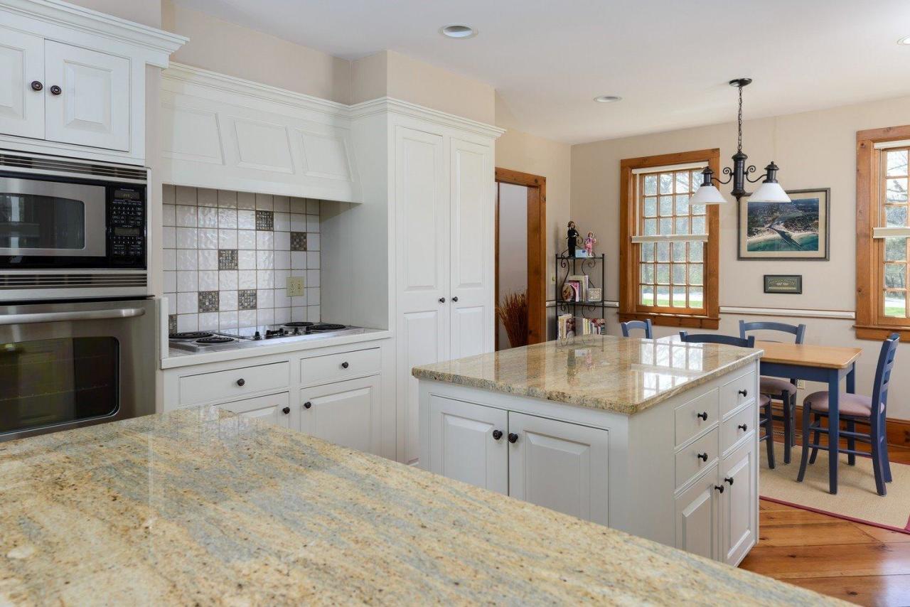 52 Point Hill Road West Barnstable, MA 02668 - Photo 8 of 28 a kitchen with stainless steel appliances kitchen island granite countertop a sink and cabinets
