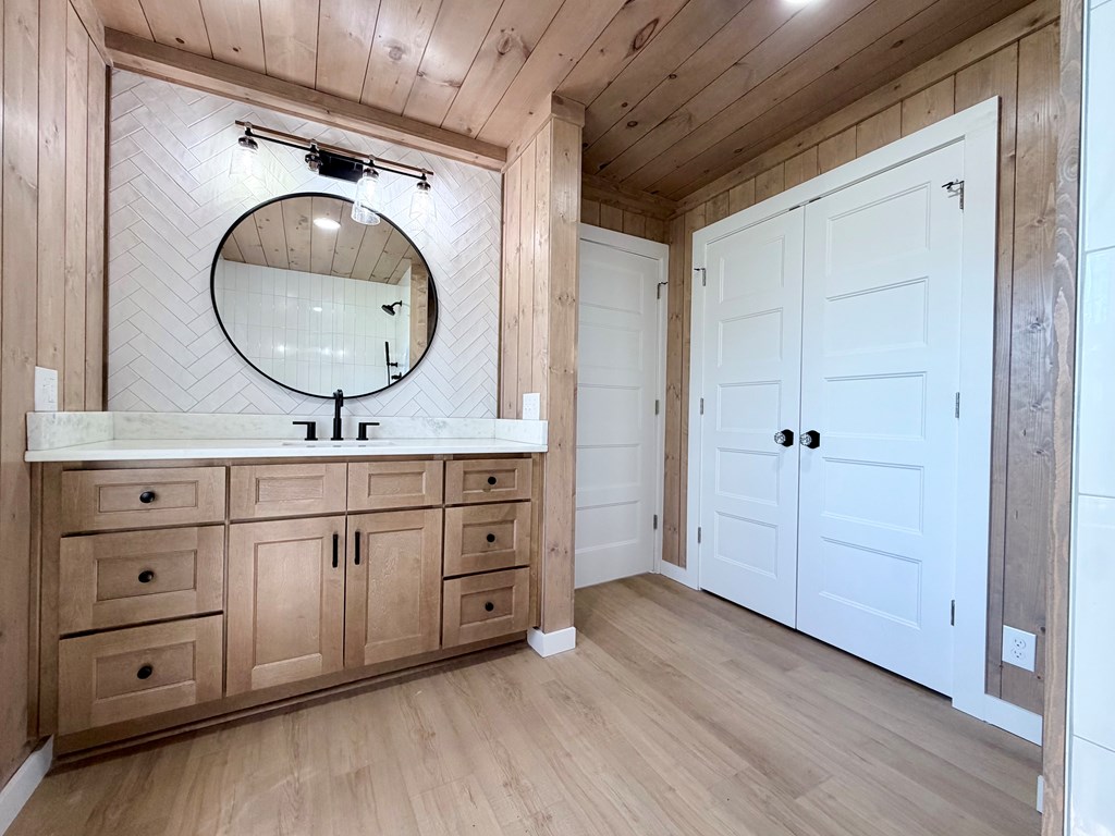 1819 Boardtown Road Ellijay, GA 30540 - Photo 12 of 13 a bathroom with a double vanity sink and a mirror