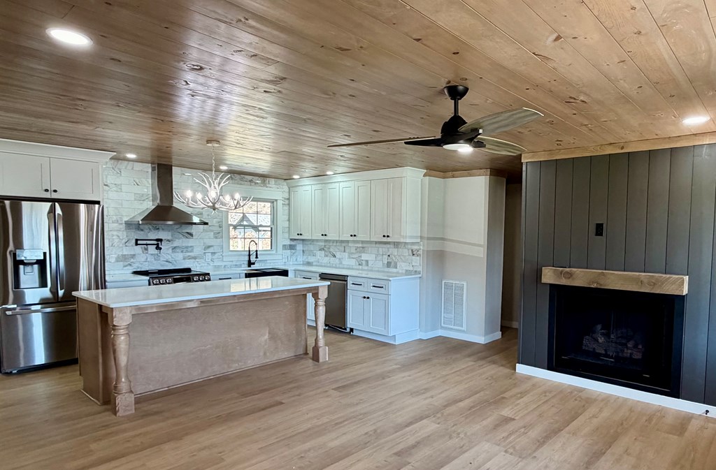 1819 Boardtown Road Ellijay, GA 30540 - Photo 3 of 13 a kitchen with stainless steel appliances wooden floor and a refrigerator