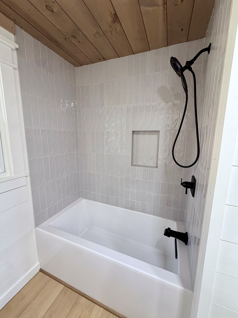 1819 Boardtown Road Ellijay, GA 30540 - Photo 10 of 13 a bathroom with a bath tub and a shower