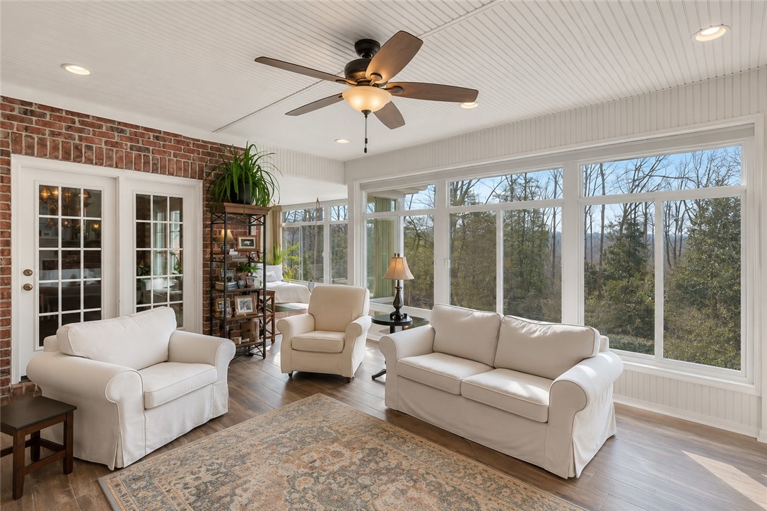 114 Augusta National Anderson, SC 29621 - Photo 47 of 47 A tranquil sunroom provides panoramic tree-lined views through its numerous large windows.
