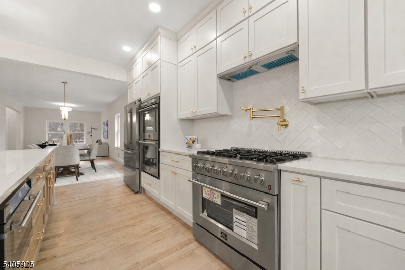 100 Louis Street Whippany, NJ 07981 - Photo 19 of 47 a kitchen with stainless steel appliances a stove a sink and a refrigerator