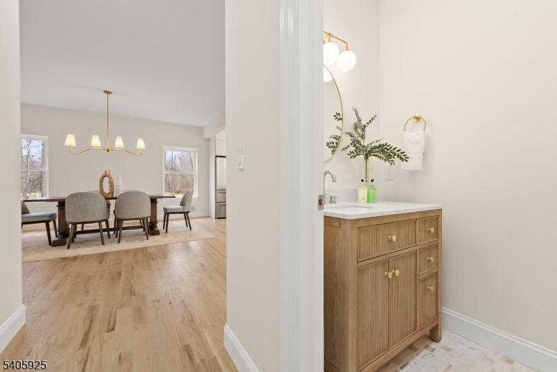 100 Louis Street Whippany, NJ 07981 - Photo 20 of 47 a view of dining room with kitchen island stainless steel appliances a sink and wooden floor