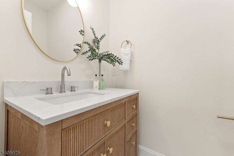 100 Louis Street Whippany, NJ 07981 - Photo 21 of 47 a bathroom with a sink and a mirror