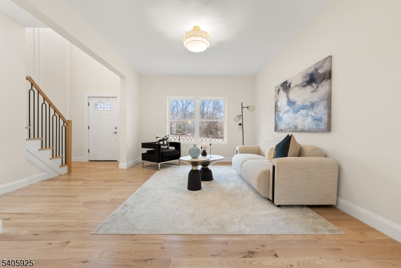 100 Louis Street Whippany, NJ 07981 - Photo 3 of 47 a living room with furniture and a large window