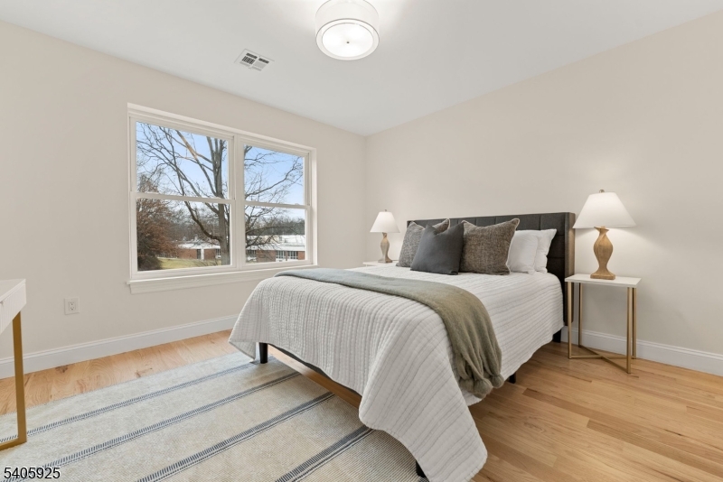 100 Louis Street Whippany, NJ 07981 - Photo 33 of 47 a bedroom with a bed and a large window