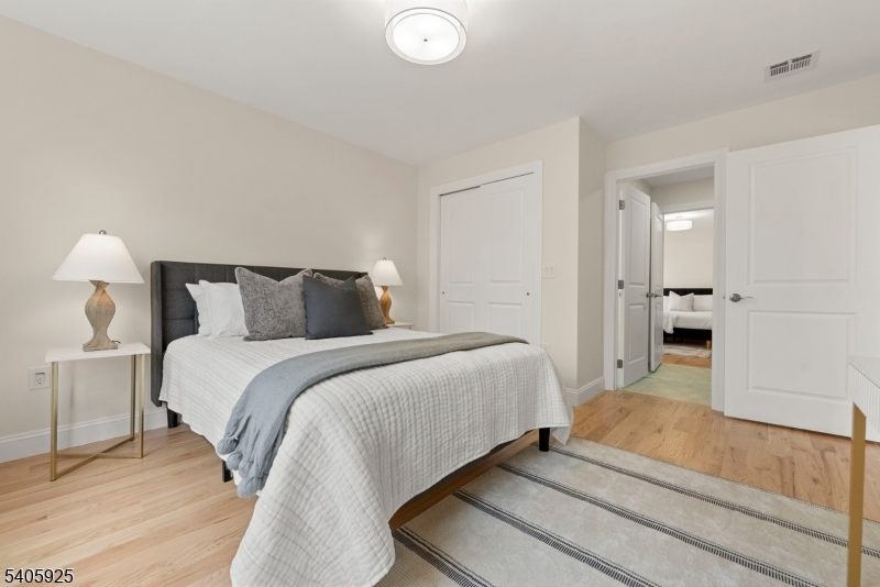 100 Louis Street Whippany, NJ 07981 - Photo 34 of 47 a bedroom with a bed and a lamp