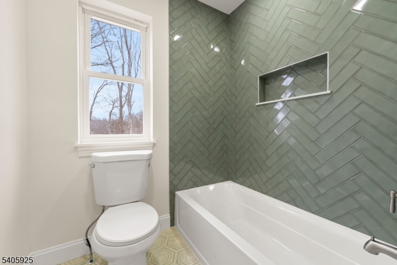 100 Louis Street Whippany, NJ 07981 - Photo 37 of 47 a white toilet sitting next to a bathtub