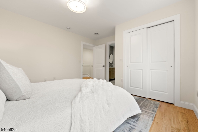 100 Louis Street Whippany, NJ 07981 - Photo 39 of 47 a large white bed in a white room