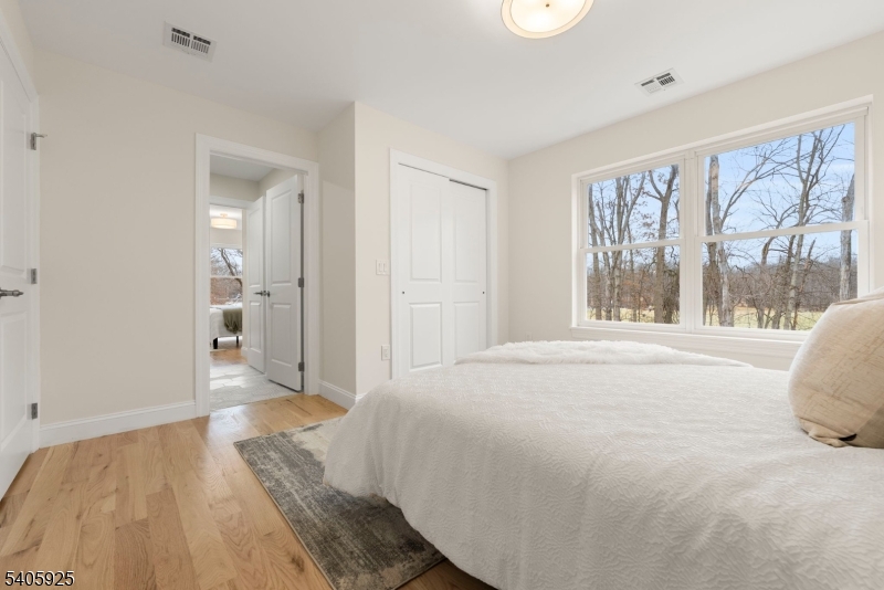 100 Louis Street Whippany, NJ 07981 - Photo 40 of 47 a spacious bedroom with a large bed and a large window
