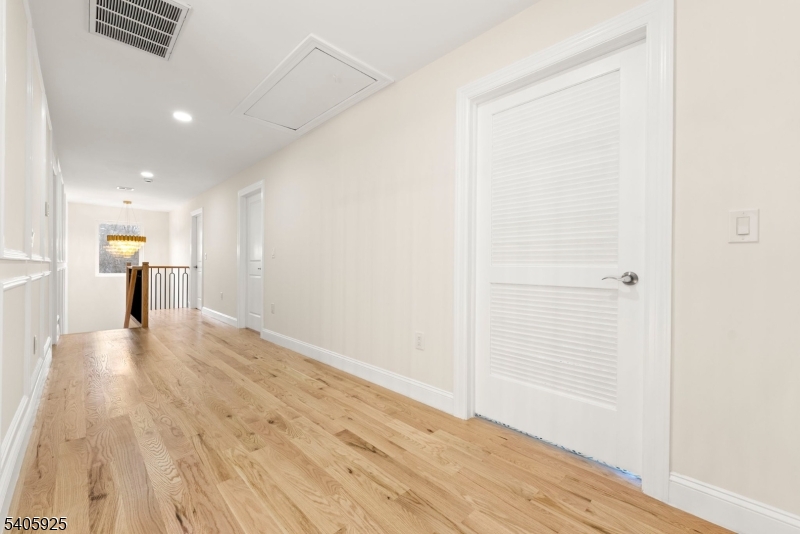 100 Louis Street Whippany, NJ 07981 - Photo 42 of 47 a view of a hallway with wooden floor