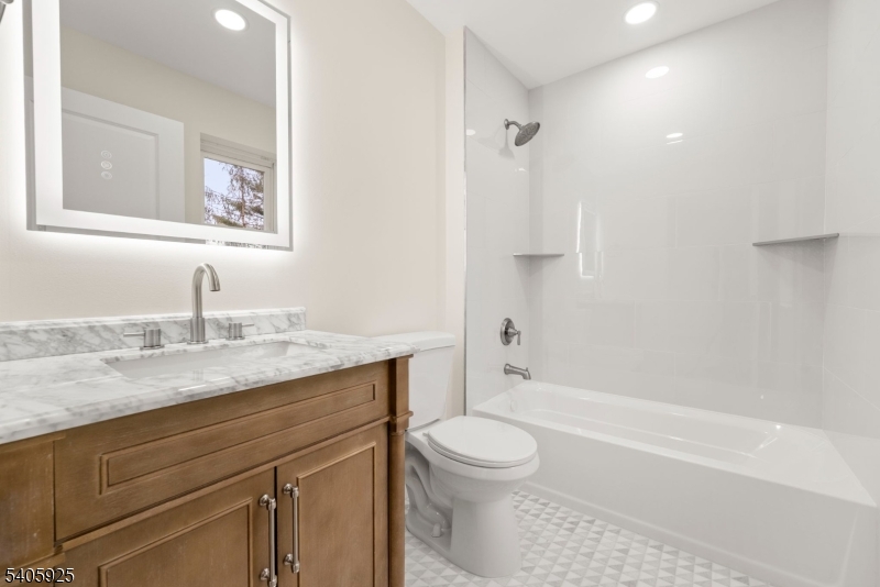 100 Louis Street Whippany, NJ 07981 - Photo 46 of 47 a bathroom with a granite countertop sink toilet and shower