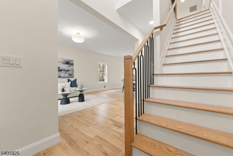 100 Louis Street Whippany, NJ 07981 - Photo 6 of 47 a view of entryway and hall with wooden floor