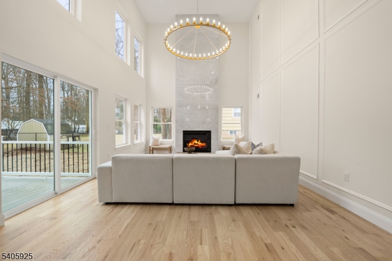 100 Louis Street Whippany, NJ 07981 - Photo 8 of 47 a living room with furniture and a fireplace