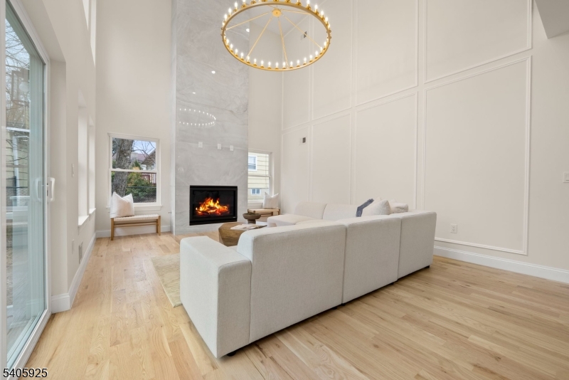 100 Louis Street Whippany, NJ 07981 - Photo 9 of 47 a living room with furniture and a fireplace