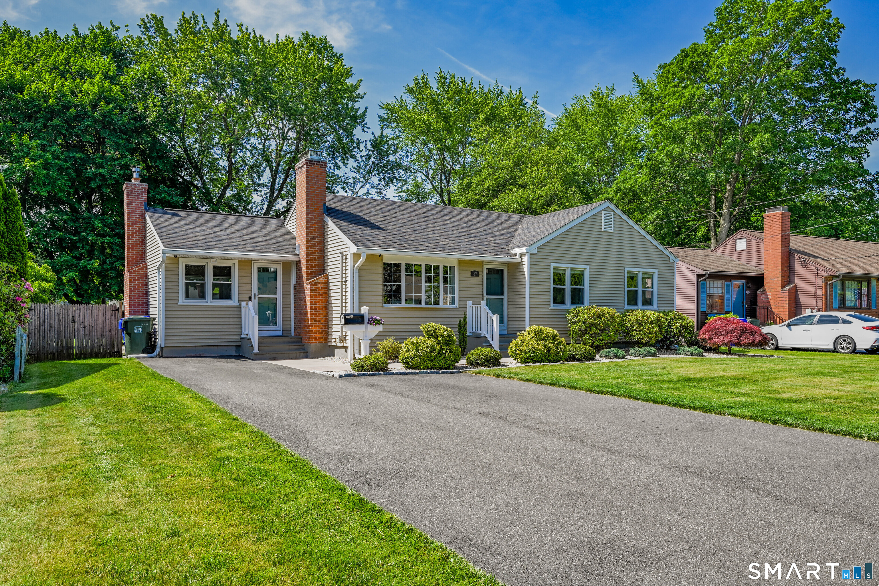 87 Lydall Road Newington, CT 06111 - Photo 4 of 35 a front view of a house with a garden and porch