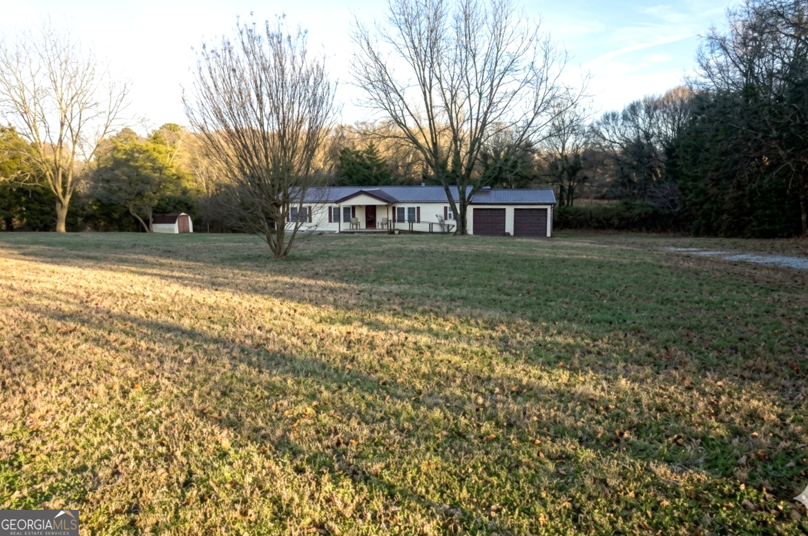 138 Omer Bond Road Royston, GA 30662 - Photo 16 of 17 a view of a yard in front of a house