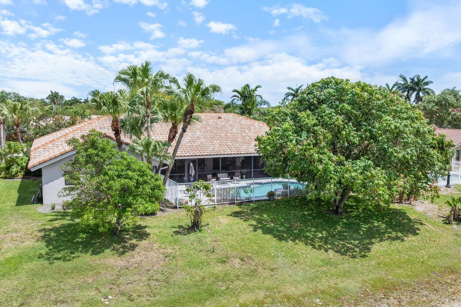 a view of a house with a yard basket ball court and outdoor seating
