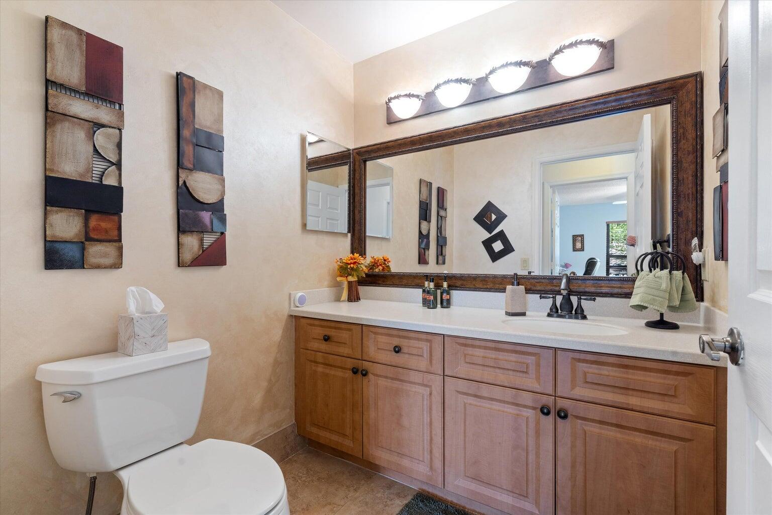 11241 Island Lakes Lane Boca Raton, FL 33498 - Photo 19 of 47 a bathroom with a toilet sink and mirror