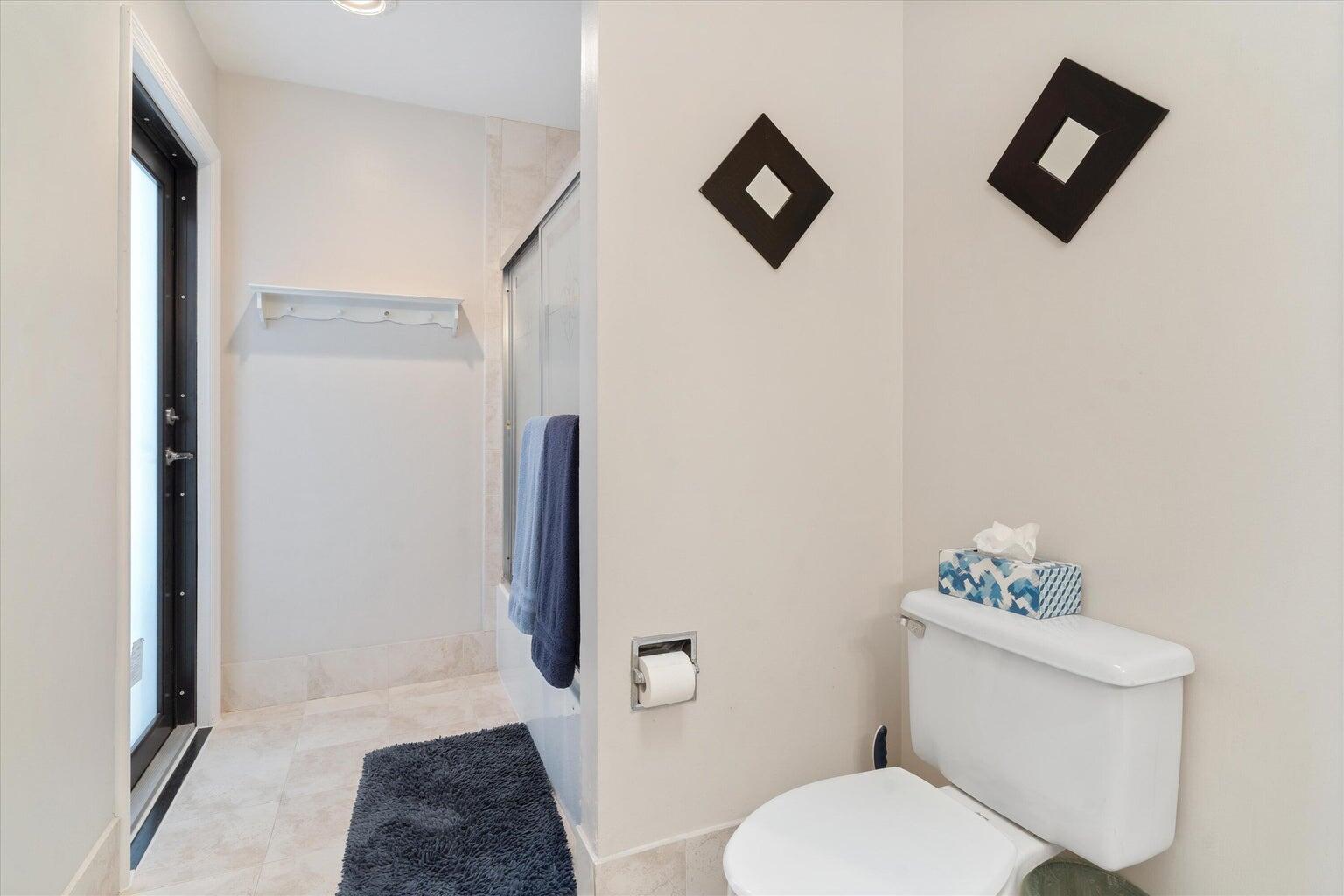 11241 Island Lakes Lane Boca Raton, FL 33498 - Photo 23 of 47 a white toilet sitting next to a bathroom sink