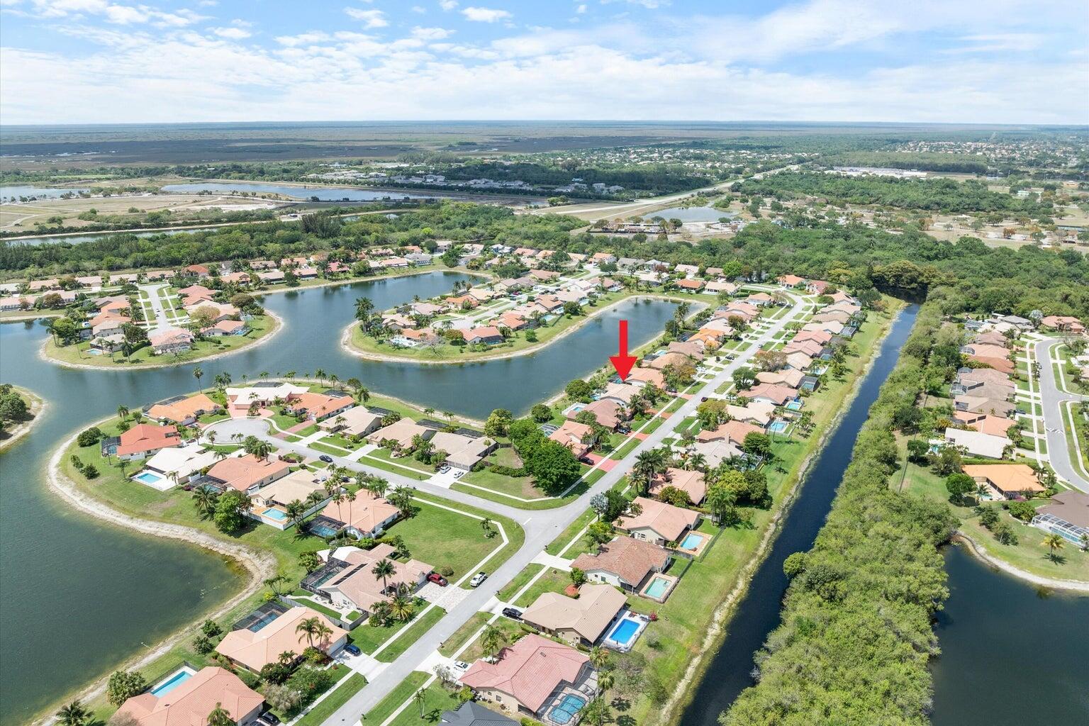 11241 Island Lakes Lane Boca Raton, FL 33498 - Photo 3 of 47 an aerial view of a city with lots of residential buildings ocean and mountain view in back