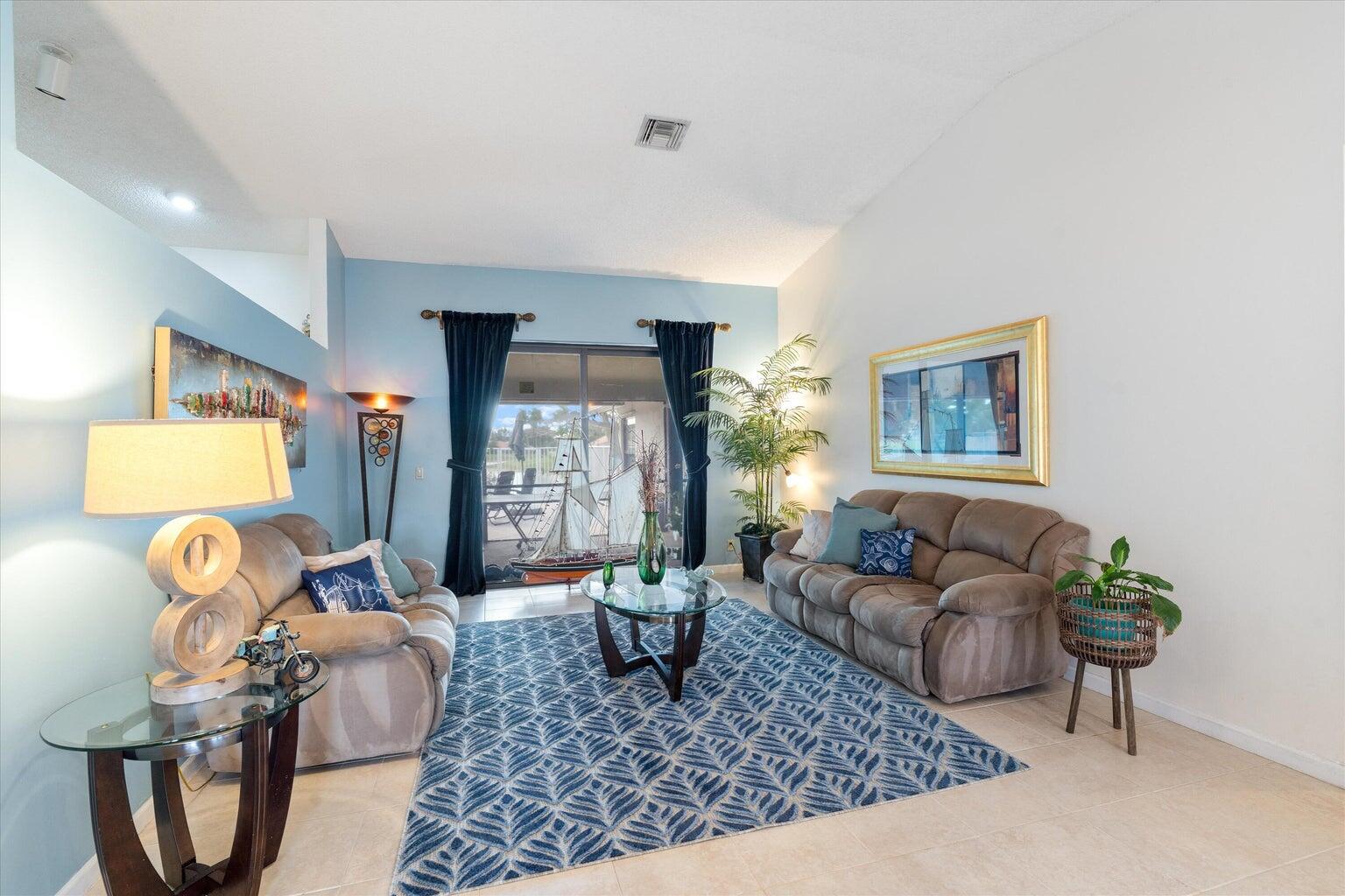 11241 Island Lakes Lane Boca Raton, FL 33498 - Photo 43 of 47 a living room with furniture a window and a potted plant