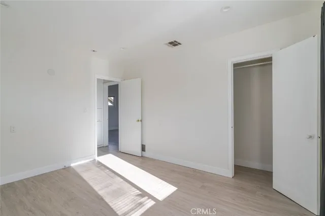 a bathroom with a granite countertop sink a mirror and a shower