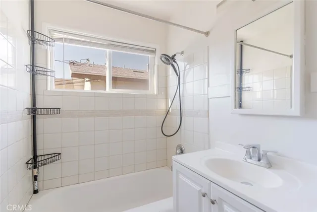a kitchen with stainless steel appliances a sink stove and refrigerator