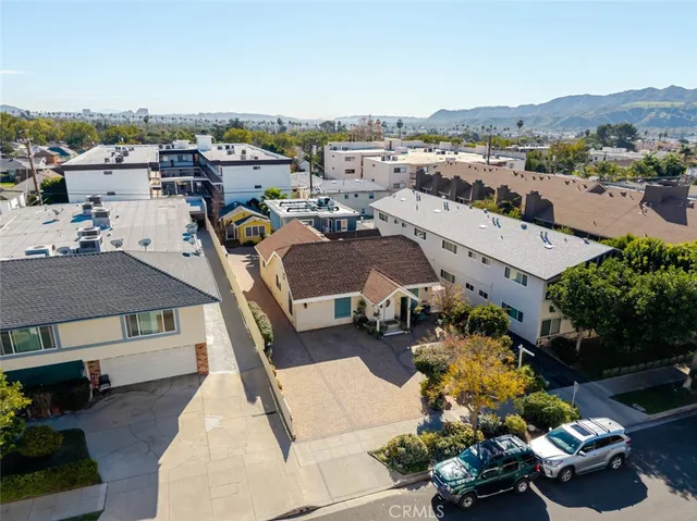 an aerial view of a house with yard swimming pool and outdoor seating