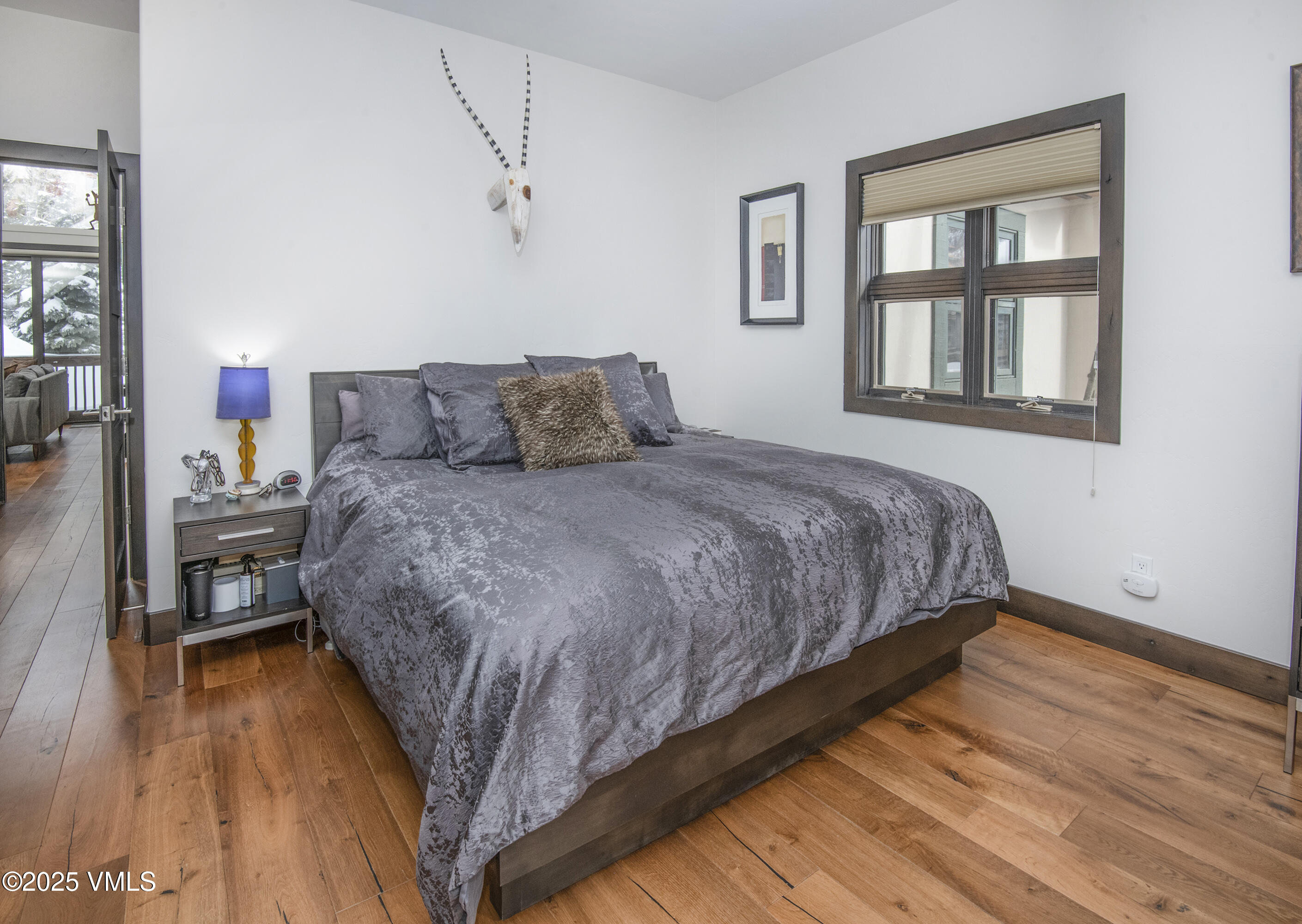 1890 Lions Ridge Loop, Unit 8 Vail, CO 81657 - Photo 14 of 39 a bedroom with a bed and a window