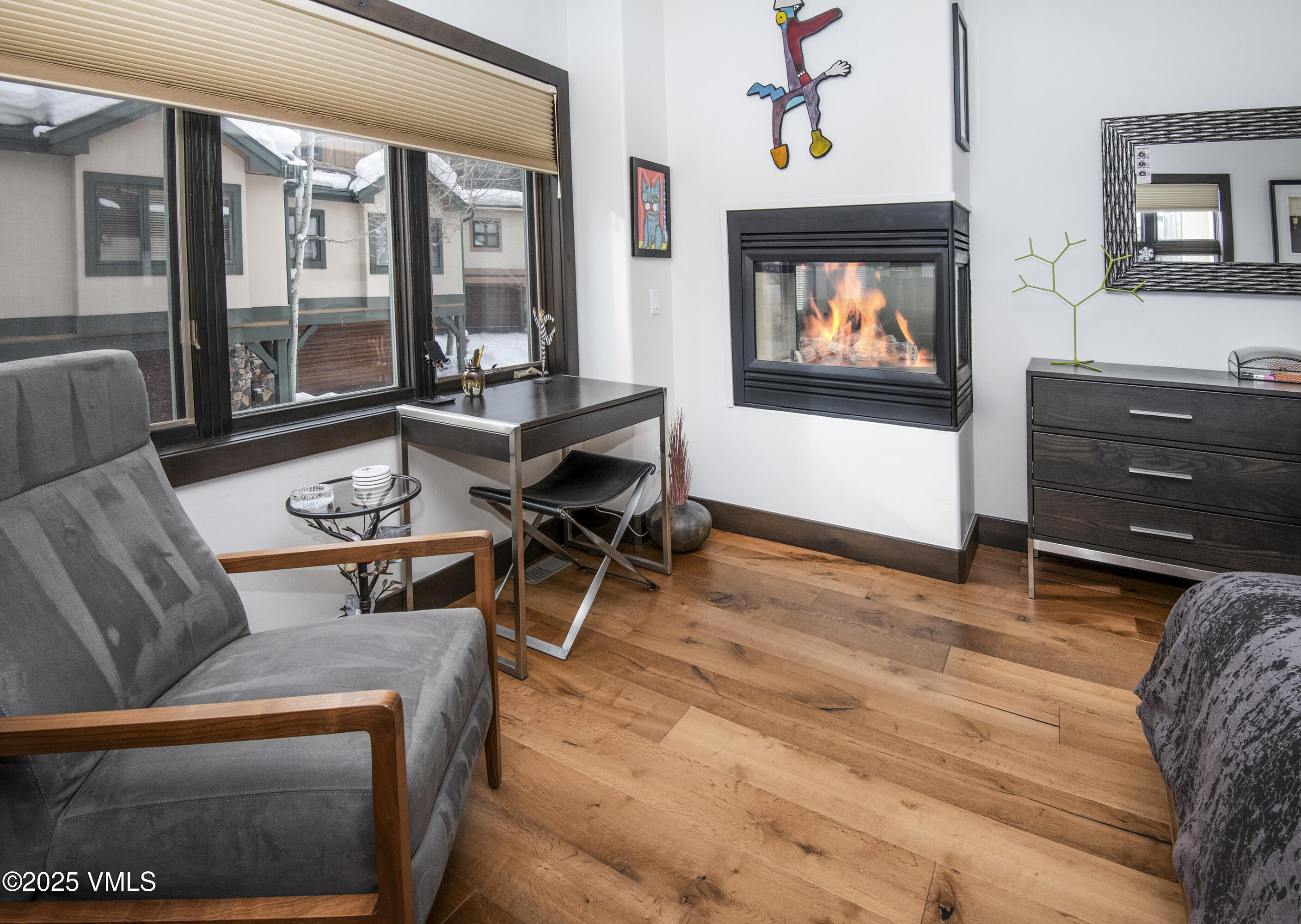 1890 Lions Ridge Loop, Unit 8 Vail, CO 81657 - Photo 15 of 39 a living room with furniture and a flat screen tv