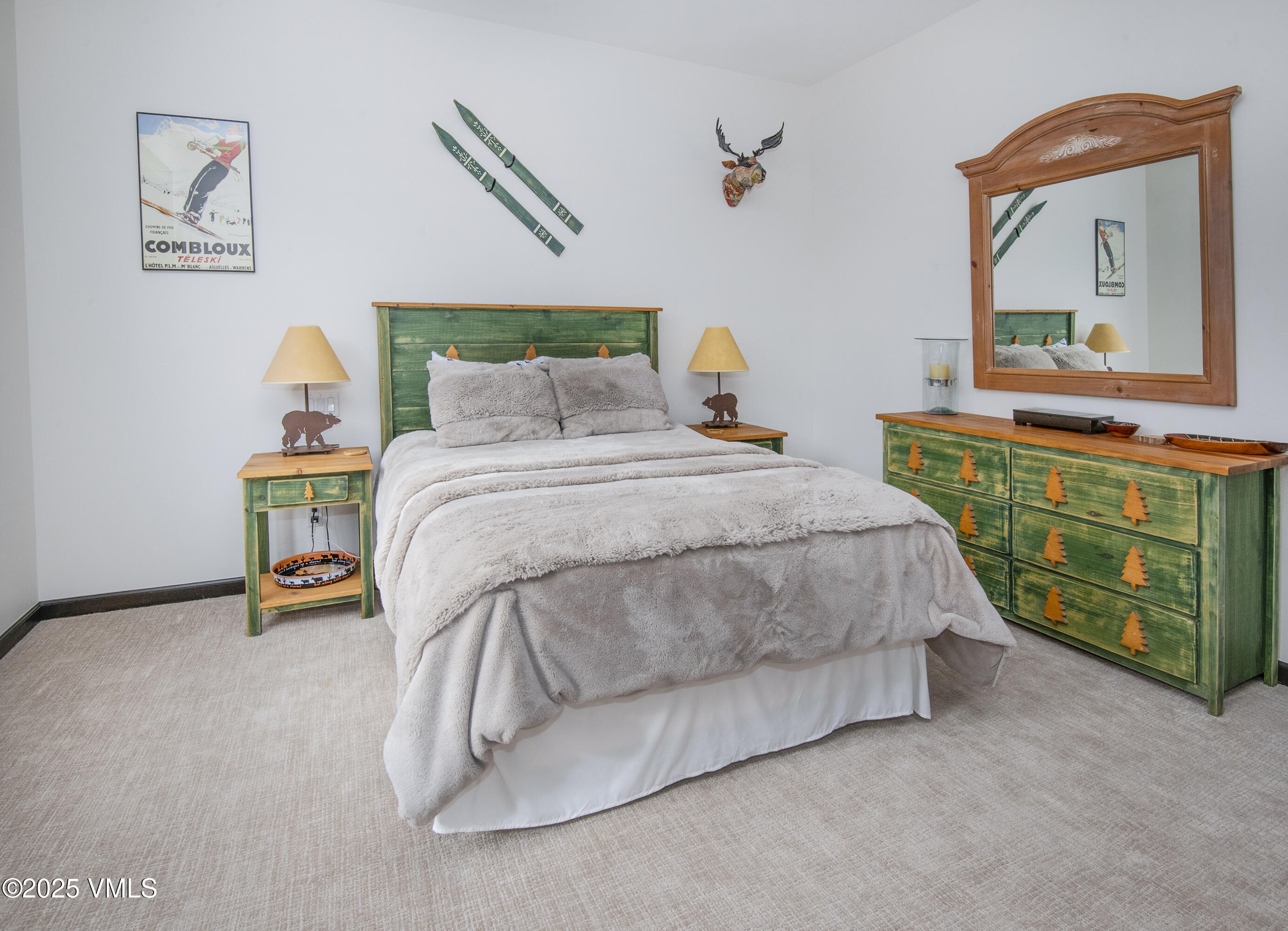 1890 Lions Ridge Loop, Unit 8 Vail, CO 81657 - Photo 25 of 39 a bedroom with a bed and a dresser in it