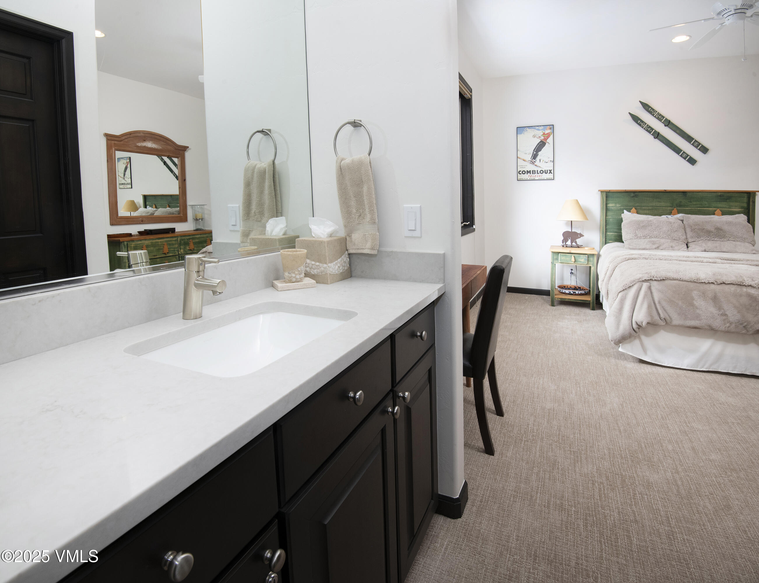 1890 Lions Ridge Loop, Unit 8 Vail, CO 81657 - Photo 26 of 39 a bathroom with double vanity and a mirror