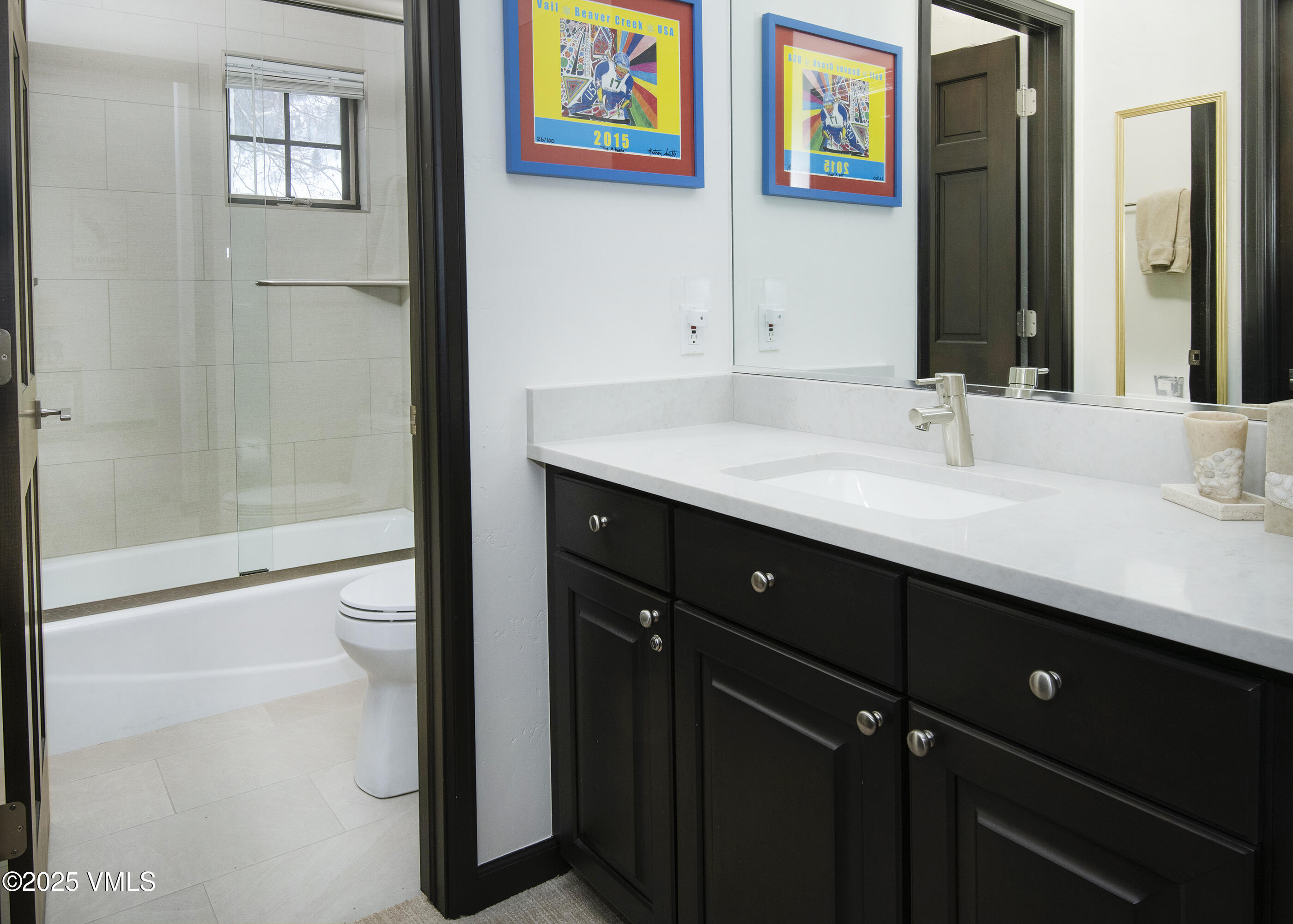 1890 Lions Ridge Loop, Unit 8 Vail, CO 81657 - Photo 27 of 39 a bathroom with a sink and a mirror