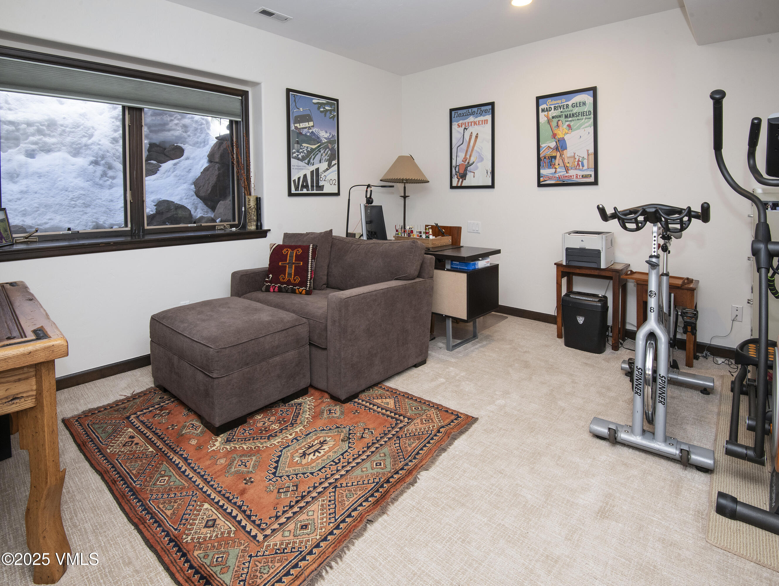 1890 Lions Ridge Loop, Unit 8 Vail, CO 81657 - Photo 29 of 39 a living room with furniture a flat screen tv and a large window