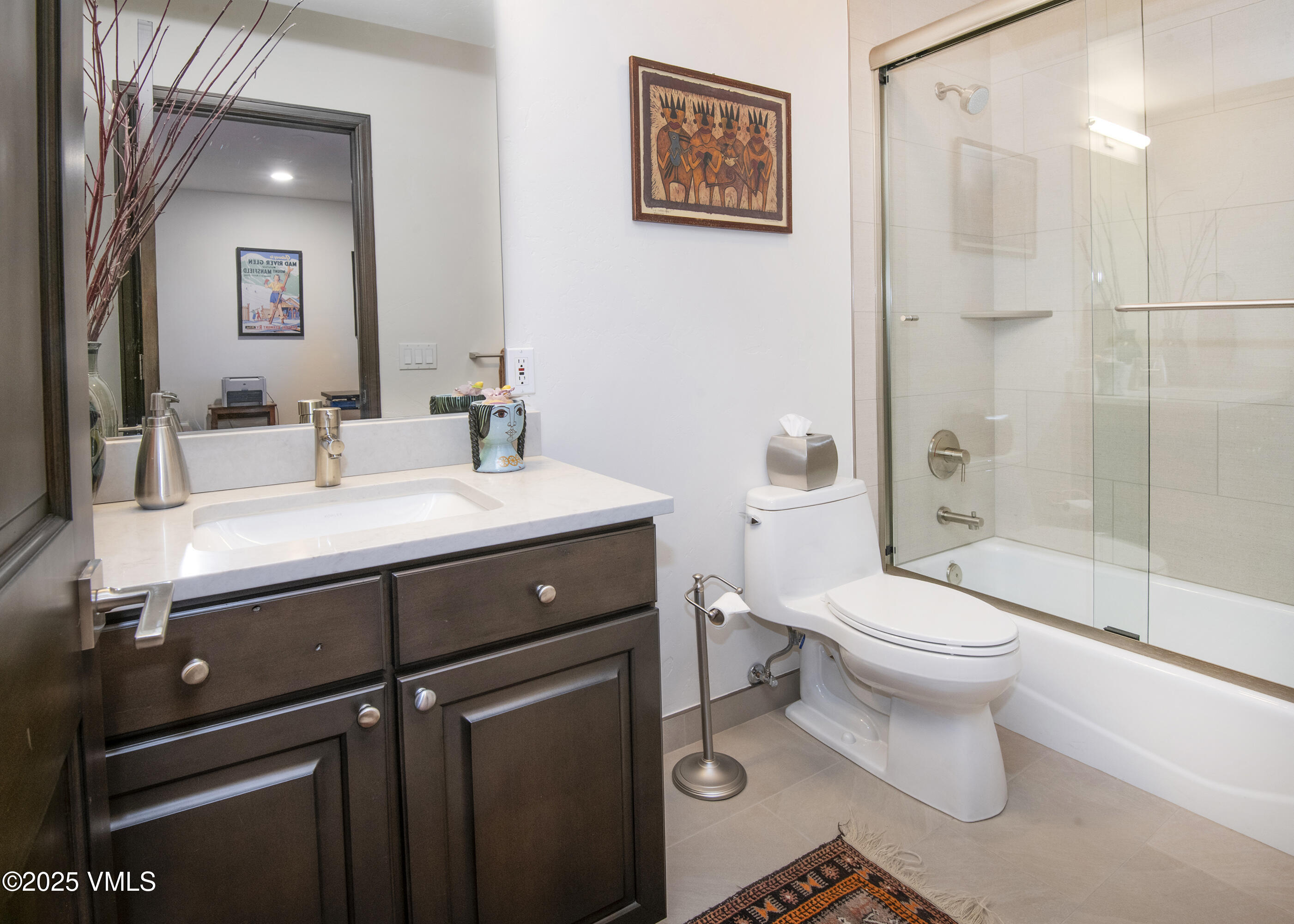 1890 Lions Ridge Loop, Unit 8 Vail, CO 81657 - Photo 30 of 39 a bathroom with a sink toilet and shower